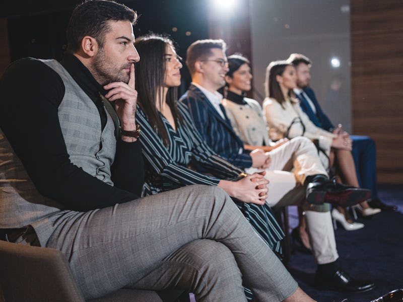 New agents watching a training video in SellMax, an online car-buying service