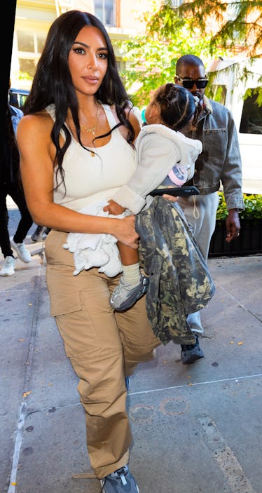 Kim Kardashian steps out with Chicago West and Kanye West.