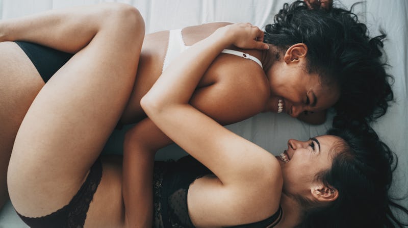 Two women prepare to have sex; the "number" of partners they've each had is totally irrelevant