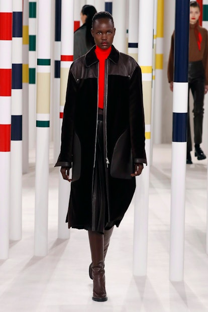 A model wearing a black and red combination from the Hermes' Fall 2020 Collection 