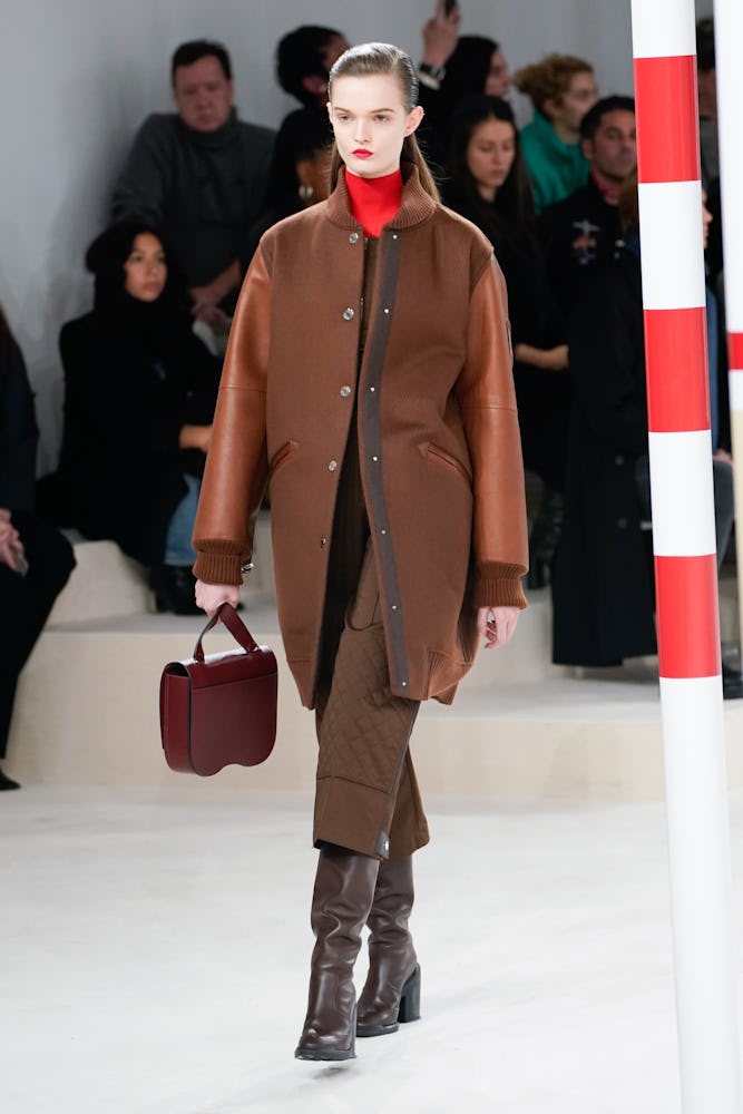 A female model wearing a brown combination from Hermes' Fall 2020 Collection