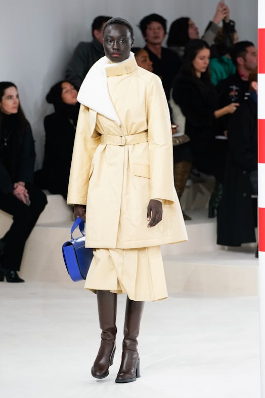 A model wearing a beige combination from Hermes' Fall 2020 Collection 