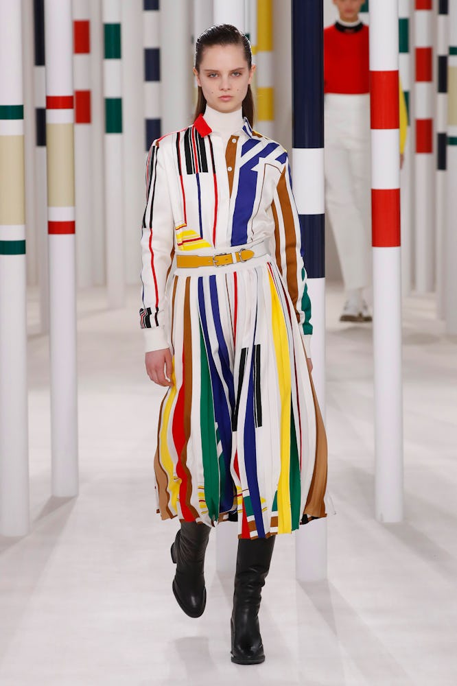A female model wearing white and colorful dress from Hermes' Fall 2020 Collection