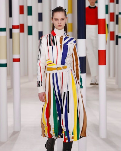 A female model wearing white and colorful dress from Hermes' Fall 2020 Collection