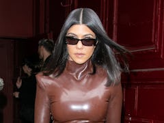 Kourtney Kardashian steps out in a latex bodysuit.