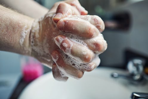 A person lathers their hands with soap. You've heard that washing your hands for 20 seconds is impor...