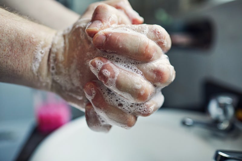 A person lathers their hands with soap. You've heard that washing your hands for 20 seconds is impor...