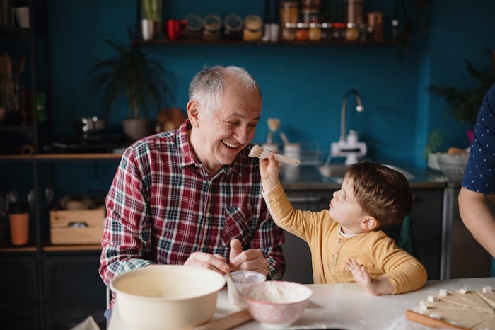 a grandfather playing with his grandson