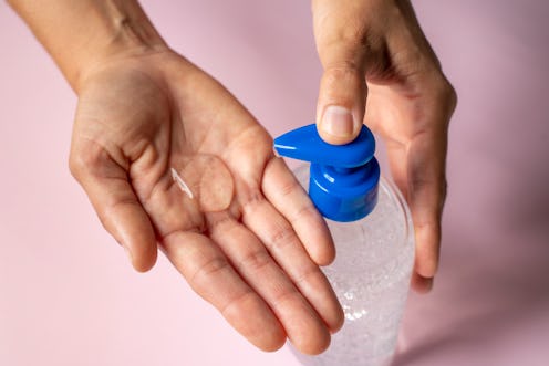 A person uses hand sanitizer. If hand sanitizer is unavailable, soap and water are just as helpful f...