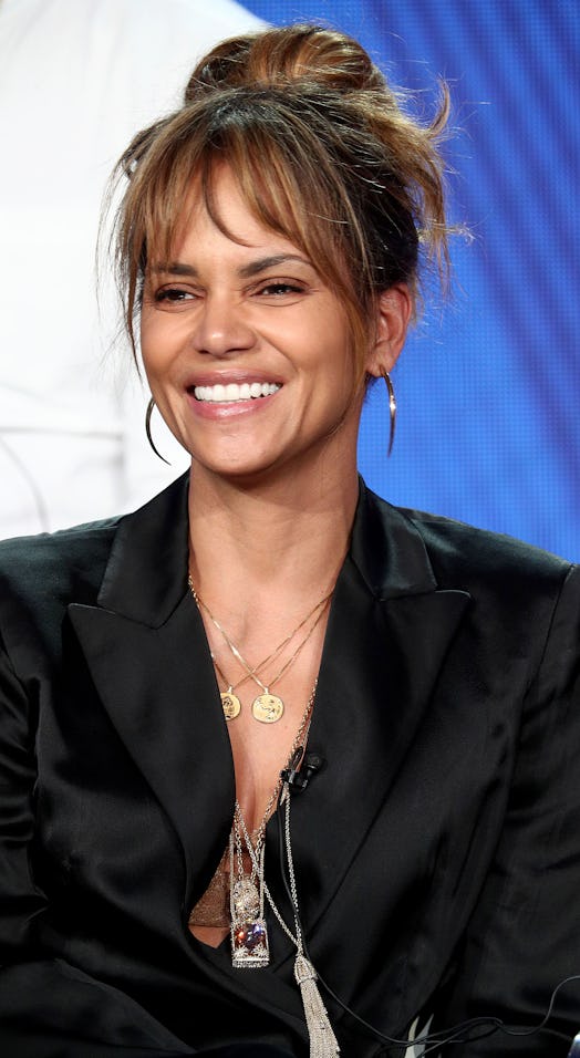 Halle Berry's '60s-inspired bun is brought up to date with her chic statement jewelry