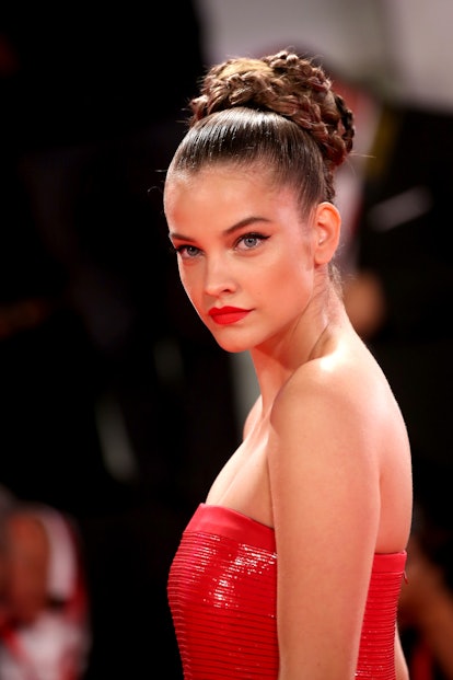 Barbara Palvin wore a braided bun and red dress on the red carpet