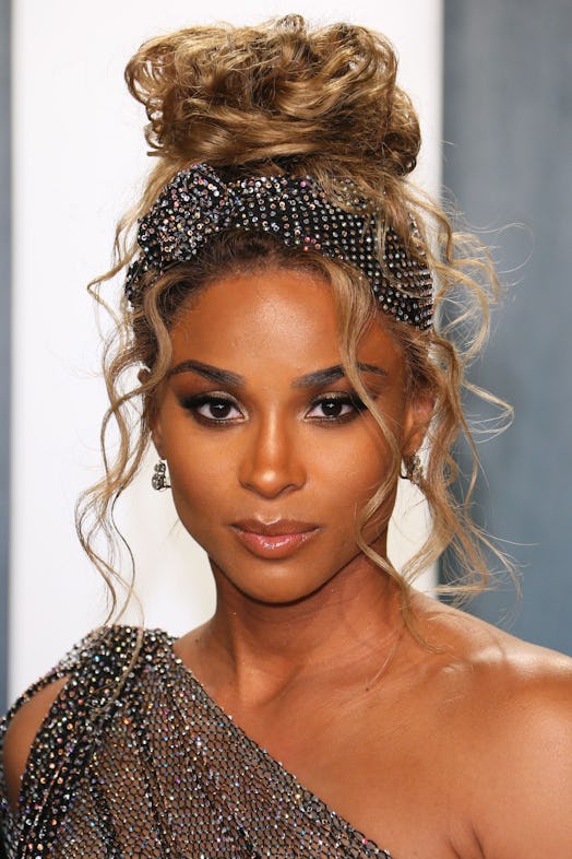 Ciara's hairstylist used a bedazzled head wrap to add interest to her high messy bun