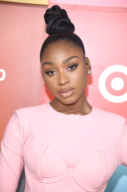 Normani sported a twisted top knot and pink eyeshadow at a Target event