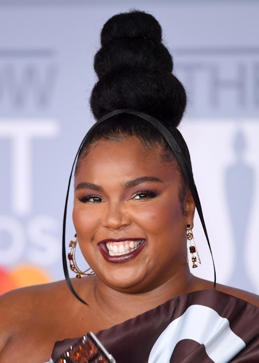 Lizzo wore a Hershey's chocolate dress with her three-bun high top knot