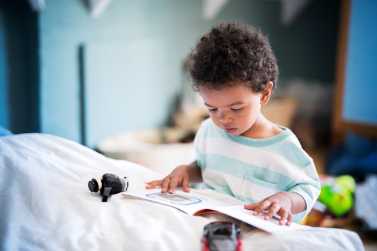 kid reading children's book about the wonder of being at home