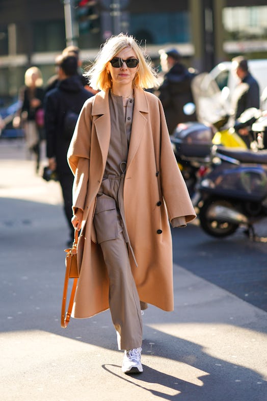 Woman wearing a trench coat. 