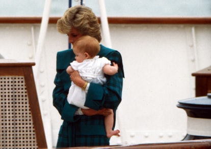 Princess Diana holds Harry tight