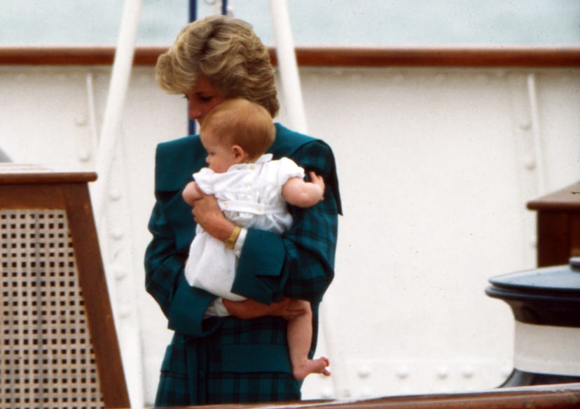Princess Diana holds Harry tight