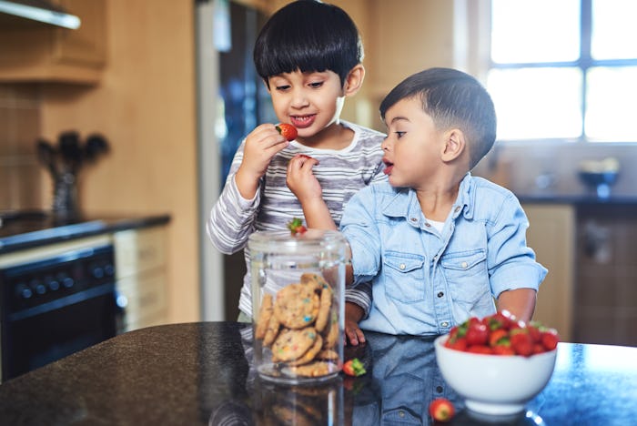 kids eating strawberries and cookies
