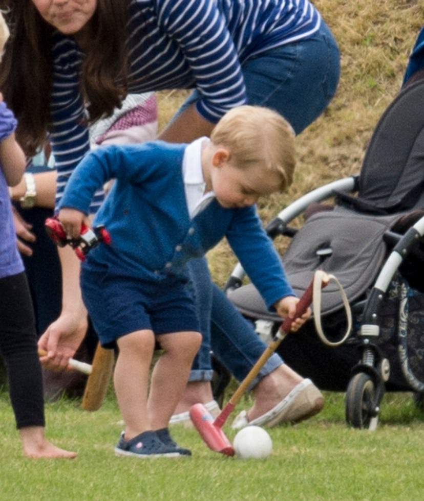 Prince George considers polo at his dad's match.