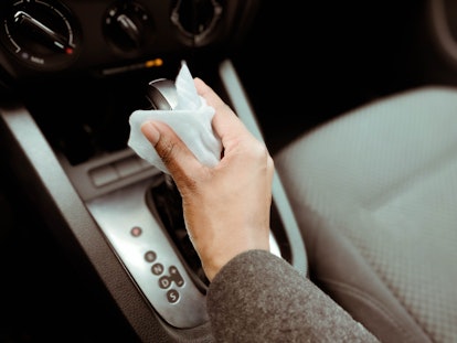 Wipe down every crevice of your car's interior with disinfectant cloths. 