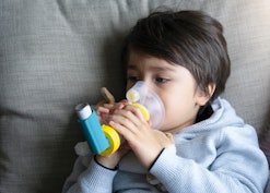 Is Coronavirus More Dangerous In Kids With Asthma? Kid using inhaler