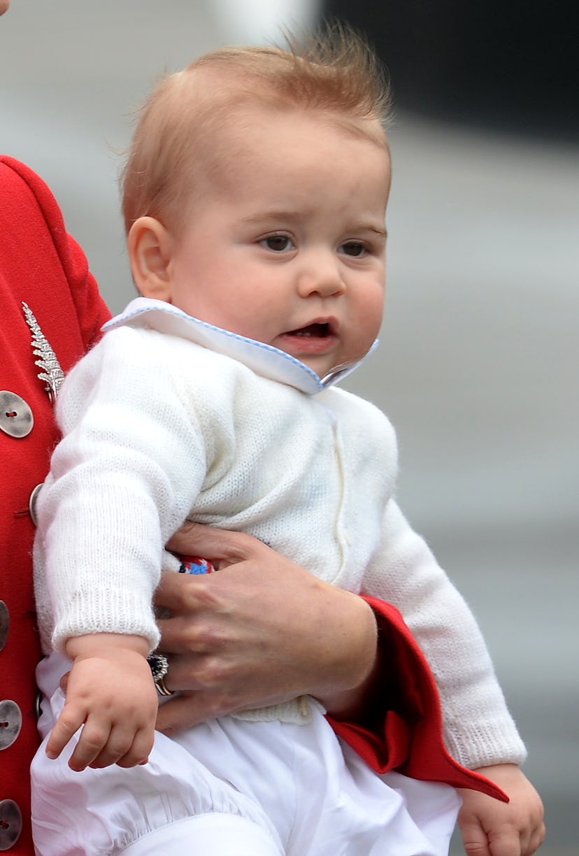 Prince George in his mother's arms.