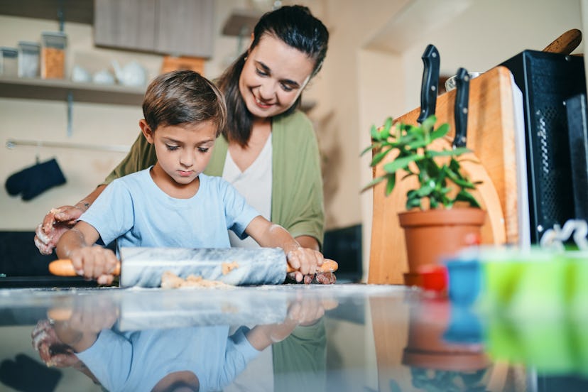 child cooking with mom to relieve stress based on kids' zodiac sign