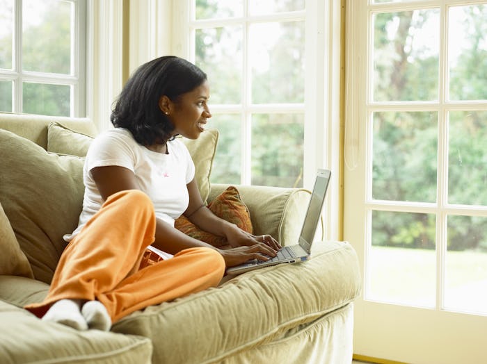 woman in sweatpants on couch