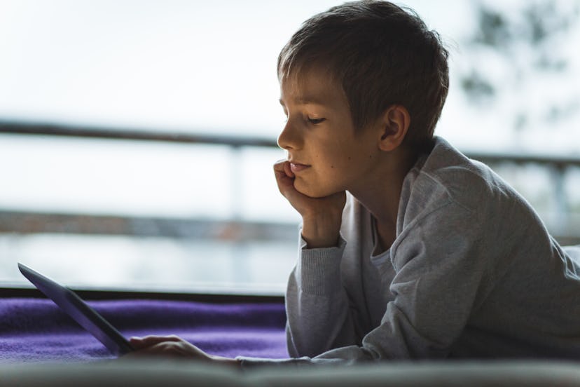 boy watching movie to relieve stress based on zodiac sign