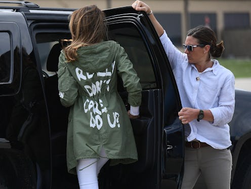 Melania Trump entering a car while wearing her 'I really don't care' jacket.'