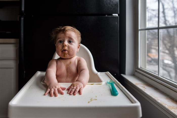 baby eating at high chair