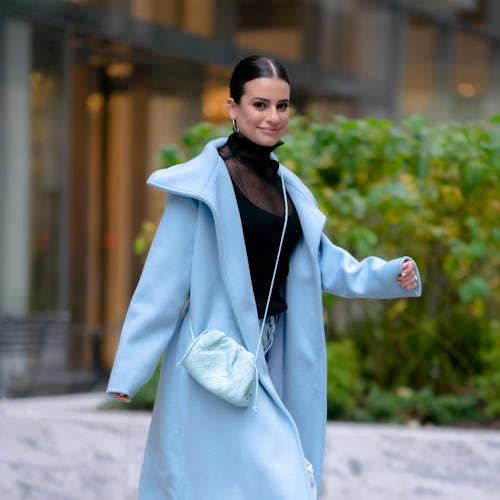 Lea Michele in a baby blue coat and matching pants with a sheer black turtleneck and black heels