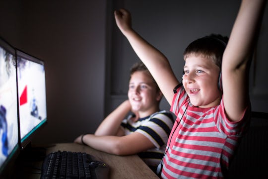 kids playing on computers/family game night