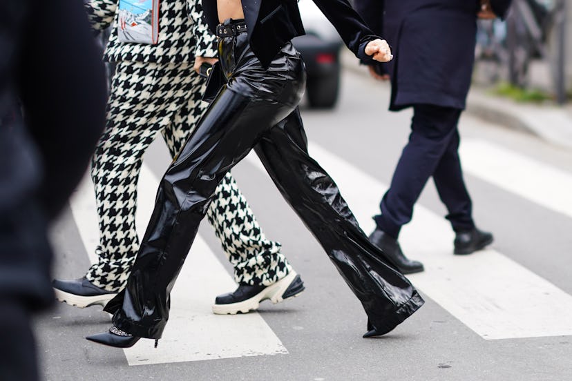 Two girls walking and crossing a street in fancy pants