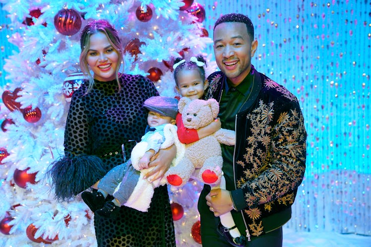 Chrissy Teigen and John Legend pose with their two kids, Luna and Miles.