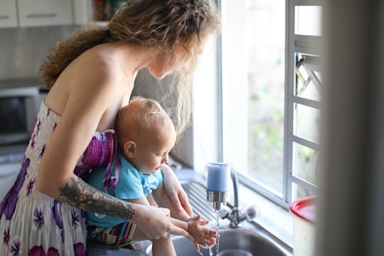 mom washing baby's hands