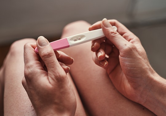 woman checking ovulation/pregnancy test