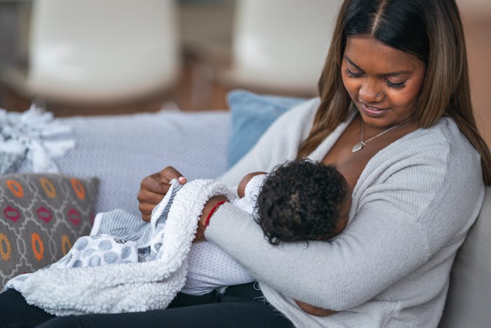 mom breastfeeding infant