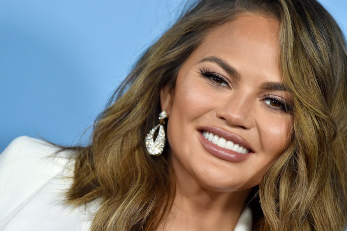 Chrissy Teigen's breast augmentation has changed since welcoming two kids.