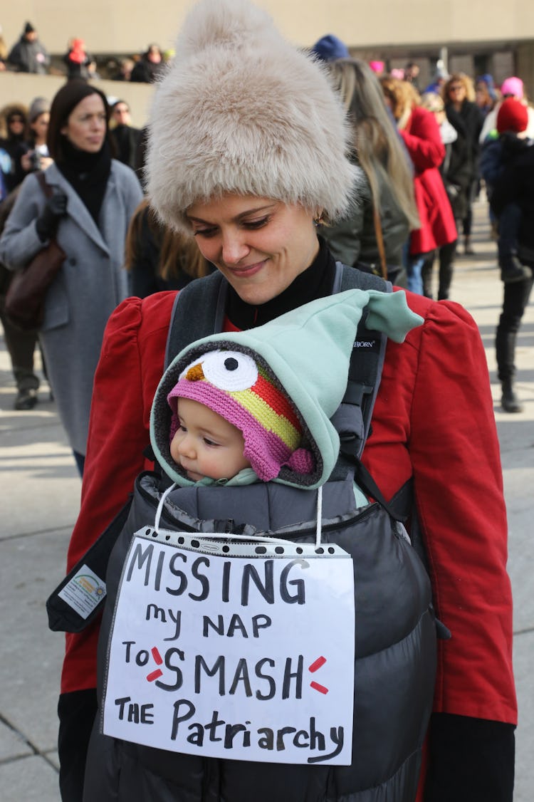 A woman and her baby braved the cold in Toronto, Canada to smash the patriarchy.