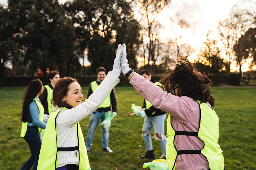 women cleaning up park