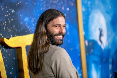 Jonathan Van Ness smiling and looking over the shoulder