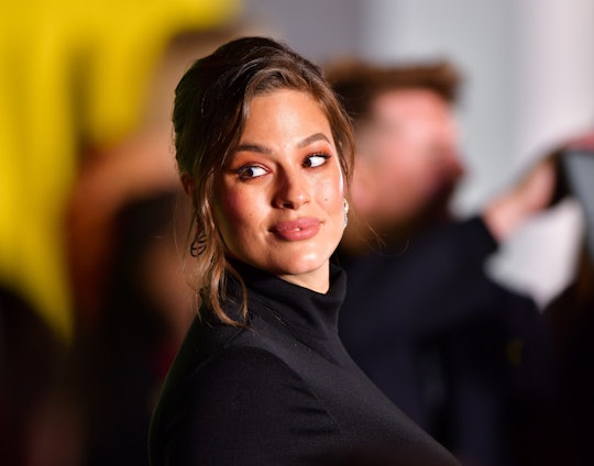 In celebration of International Women's Day, model Ashley Graham shared a photograph of her giving b...