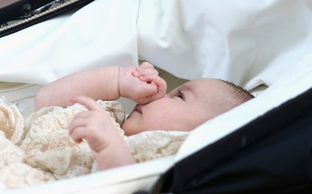 Charlotte lays in her bassinet on the way to her christening 