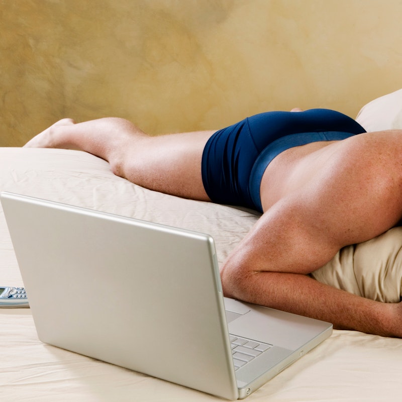 A man lies in his underwear watching porn on a laptop. What does anal sex feel like for men? We aske...