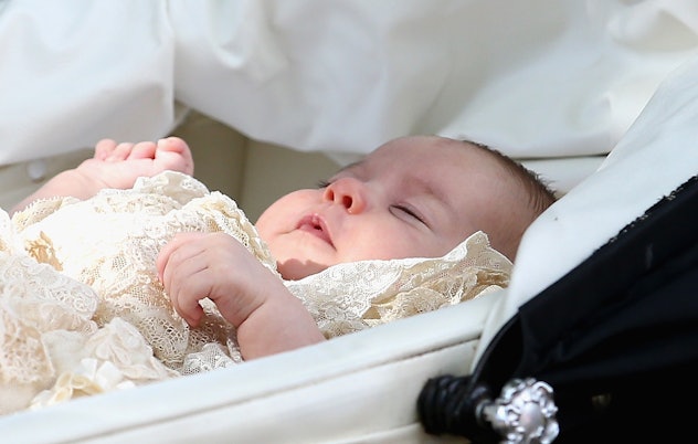 Princess Charlotte looks sleepy in her bassinet