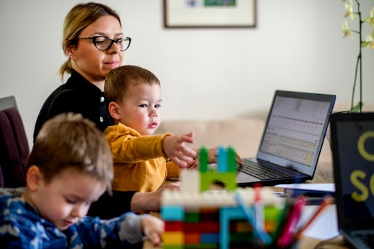 mom working from home with two small boys