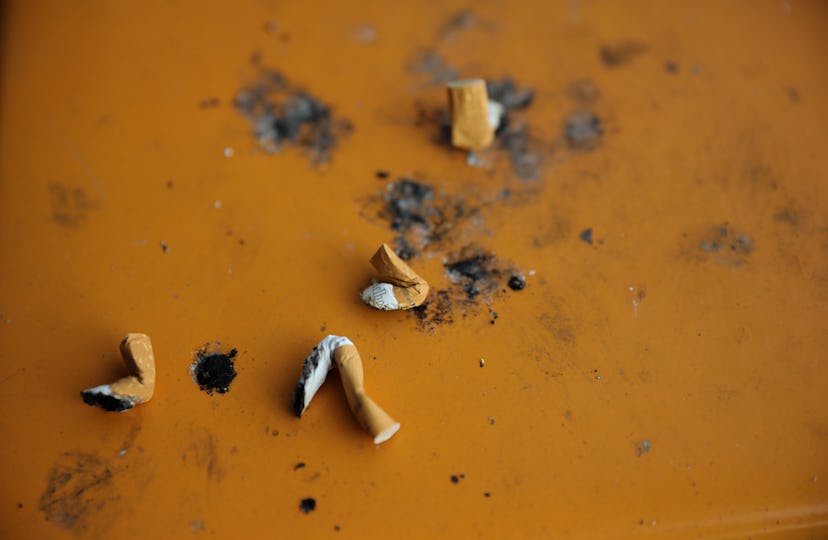 Cigarette butts on the ground. Smoking may affect your cycle, experts say. 