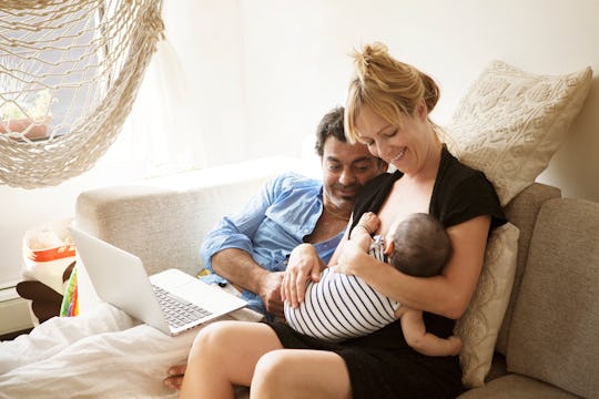 dad and breastfeeding mom with baby 